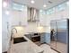 Bright modern kitchen featuring stainless steel appliances, granite countertops, and ample cabinet space at 941 N Osprey Ave, Sarasota, FL 34236