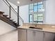 Open-concept kitchen with granite countertops, stainless steel appliances, and natural lighting at 941 N Osprey Ave, Sarasota, FL 34236