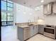 Open concept kitchen with granite countertops, stainless appliances, and great natural lighting at 941 N Osprey Ave, Sarasota, FL 34236
