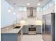 Modern kitchen features stainless steel appliances, granite countertops and custom cabinets at 941 N Osprey Ave, Sarasota, FL 34236