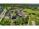 Expansive aerial shot showcases the golf course, clubhouse, and community amenities at 9620 Club South Cir # 5208, Sarasota, FL 34238