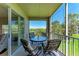 Balcony with comfortable seating overlooking a golf course at 9620 Club South Cir # 5208, Sarasota, FL 34238