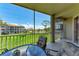 Screened balcony with seating overlooking a manicured lawn at 9620 Club South Cir # 5208, Sarasota, FL 34238