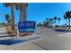 Lido Beach Pool & Pavilion North Entrance sign on a sunny day near palm trees and parking at 9620 Club South Cir # 5208, Sarasota, FL 34238