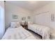 Charming bedroom with two twin beds, coastal decor, and ample closet space, perfect for guests at 9620 Club South Cir # 5208, Sarasota, FL 34238