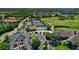 Beautiful aerial view featuring community tennis courts, pool, and clubhouse at 9620 Club South Cir # 5208, Sarasota, FL 34238