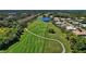 Scenic aerial shot of the golf course and pond highlighting community landscaping at 9620 Club South Cir # 5208, Sarasota, FL 34238