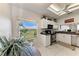 Bright kitchen featuring a scenic view, granite countertops, and stainless steel appliances at 9620 Club South Cir # 5208, Sarasota, FL 34238