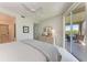 Bright main bedroom with a sliding glass door to balcony, light-colored furniture, and neutral tones at 9620 Club South Cir # 5208, Sarasota, FL 34238