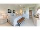 Serene main bedroom featuring a plush king bed, a calming color palette, and a glimpse into the ensuite bathroom at 9620 Club South Cir # 5208, Sarasota, FL 34238