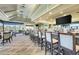Bar in the community clubhouse featuring seating, large windows, and views of the outside at 4812 Sand Trap E Cir, Bradenton, FL 34203