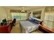 Inviting bedroom with a ceiling fan, a window and comfortable furnishings at 4812 Sand Trap E Cir, Bradenton, FL 34203