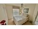 Comfortable bedroom with a bright window, closet, and neutral decor create a peaceful retreat at 4812 Sand Trap E Cir, Bradenton, FL 34203