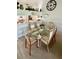 A cozy dining area featuring a glass table and light fixture at 4812 Sand Trap E Cir, Bradenton, FL 34203