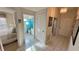 Bright hallway with tile floors leading to bathroom and bedroom at 4812 Sand Trap E Cir, Bradenton, FL 34203