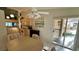 Open kitchen with wood cabinets, stainless appliances, and an adjacent breakfast nook with sliding glass door at 4812 Sand Trap E Cir, Bradenton, FL 34203