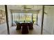Enclosed lanai with a dining area, providing a comfortable space to enjoy the outdoors at 4812 Sand Trap E Cir, Bradenton, FL 34203