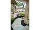 Landscaped walkway featuring lush greenery and a concrete path leading to the home's entrance at 4812 Sand Trap E Cir, Bradenton, FL 34203