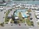 Aerial view of community amenities, showcasing the pool, tennis court, and recreation areas at 104 1St Ave, Venice, FL 34285