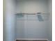 Empty closet showcasing a single wire shelf and white walls, ready to organize your belongings at 104 1St Ave, Venice, FL 34285