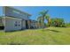 A spacious backyard features a screened patio and ample green space at 1085 Mallard Marsh Dr, Osprey, FL 34229