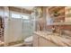 Bathroom showcasing a marble vanity, a glass shower and a wall with beautiful finishings at 1085 Mallard Marsh Dr, Osprey, FL 34229
