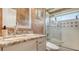 Bathroom featuring marble vanity, a frameless glass shower and a tiled wall at 1085 Mallard Marsh Dr, Osprey, FL 34229