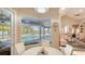 Breakfast nook with a view of the pool and outdoor living area at 1085 Mallard Marsh Dr, Osprey, FL 34229