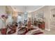 Dining room with a large wood table and access to an outdoor view at 1085 Mallard Marsh Dr, Osprey, FL 34229