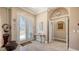 Elegant foyer features tiled floors, a decorative table, and an arched doorway at 1085 Mallard Marsh Dr, Osprey, FL 34229