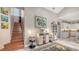 Elegant foyer with staircase leading to the second floor and a view to the kitchen at 1085 Mallard Marsh Dr, Osprey, FL 34229