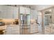 Updated kitchen featuring stainless steel appliances, light cabinetry, and granite countertops at 1085 Mallard Marsh Dr, Osprey, FL 34229