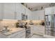 Bright kitchen with stainless steel appliances and sleek, modern cabinets with under cabinet lighting at 1085 Mallard Marsh Dr, Osprey, FL 34229