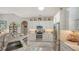 Spacious kitchen with marble countertops, stainless appliances, and ample cabinet space at 1085 Mallard Marsh Dr, Osprey, FL 34229