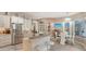 Open kitchen with stainless steel appliances, marble countertops, and a breakfast bar with seating at 1085 Mallard Marsh Dr, Osprey, FL 34229