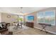 Bright living room with serene backyard views, ceiling fan, and decorative accents at 1085 Mallard Marsh Dr, Osprey, FL 34229