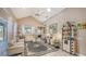 Bright living room with vaulted ceilings, light walls, and elegant furnishings at 1085 Mallard Marsh Dr, Osprey, FL 34229