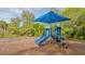 Neighborhood playground with a blue-covered slide, swing set, and soft ground cover at 1085 Mallard Marsh Dr, Osprey, FL 34229