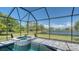 A luxurious pool and spa are enclosed in a screened lanai, providing a beautiful backyard retreat at 1085 Mallard Marsh Dr, Osprey, FL 34229