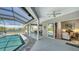 A beautiful pool and outdoor living space featuring a screened enclosure and serene lake views at 1085 Mallard Marsh Dr, Osprey, FL 34229