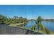 A scenic view of a lake from a screened lanai, offering a tranquil setting at 1085 Mallard Marsh Dr, Osprey, FL 34229