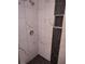 This shower features updated tile and a shower niche at 1102 Temple Ave, Bradenton, FL 34207