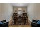 Dining room with a chandelier, wood table, and a patterned rug at 12740 Del Corso Loop, Lakewood Ranch, FL 34211