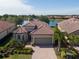 Beautiful one-story home with lush landscaping and stunning lake view at 12740 Del Corso Loop, Lakewood Ranch, FL 34211