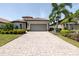 Charming home featuring a paved driveway and beautiful landscaping at 12740 Del Corso Loop, Lakewood Ranch, FL 34211