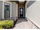 Inviting front entrance with stone accents and manicured landscaping leading to a stylish front door at 12740 Del Corso Loop, Lakewood Ranch, FL 34211