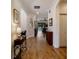Open hallway featuring hardwood floors leading to the main living spaces and lake views at 12740 Del Corso Loop, Lakewood Ranch, FL 34211
