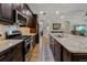 Spacious kitchen with granite countertops, a large island, and stainless steel appliances, great for entertaining at 12740 Del Corso Loop, Lakewood Ranch, FL 34211