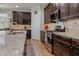 Updated kitchen with stainless appliances, stone countertops, and ample cabinet space at 12740 Del Corso Loop, Lakewood Ranch, FL 34211