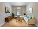 Bright living room with coastal decor, a plush sofa, and a woven rug at 12740 Del Corso Loop, Lakewood Ranch, FL 34211